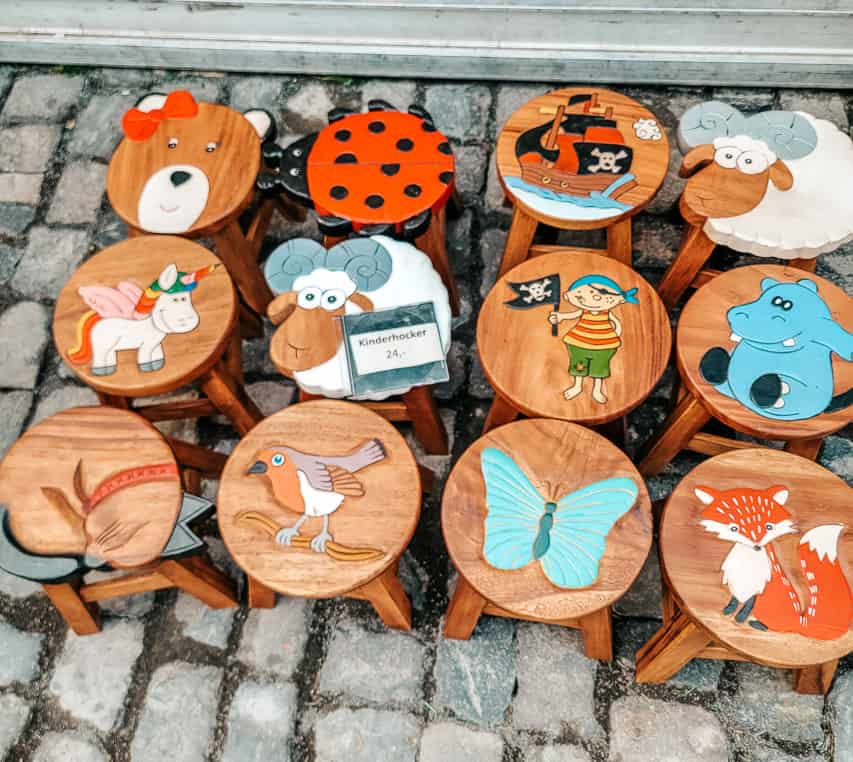 A close up of some painted stools being sold in the Harbor Market.