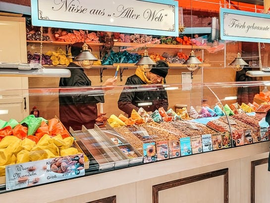 A stall with an impressive display of flavored nuts.