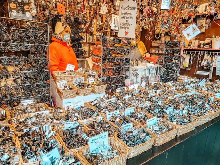 A stall in the the Angel Market selling basketballs and shelves full of cookie cutters.