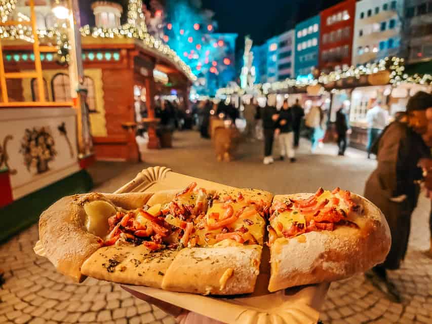 flammekuchen in Germany - a pizza like dish with puffy crust and toppings like creme freche and potatoes.