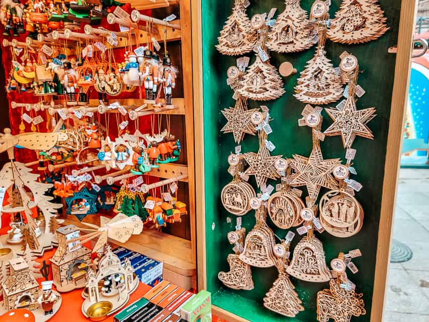 A variety of wooden ornaments hung up in a stall at the markets.