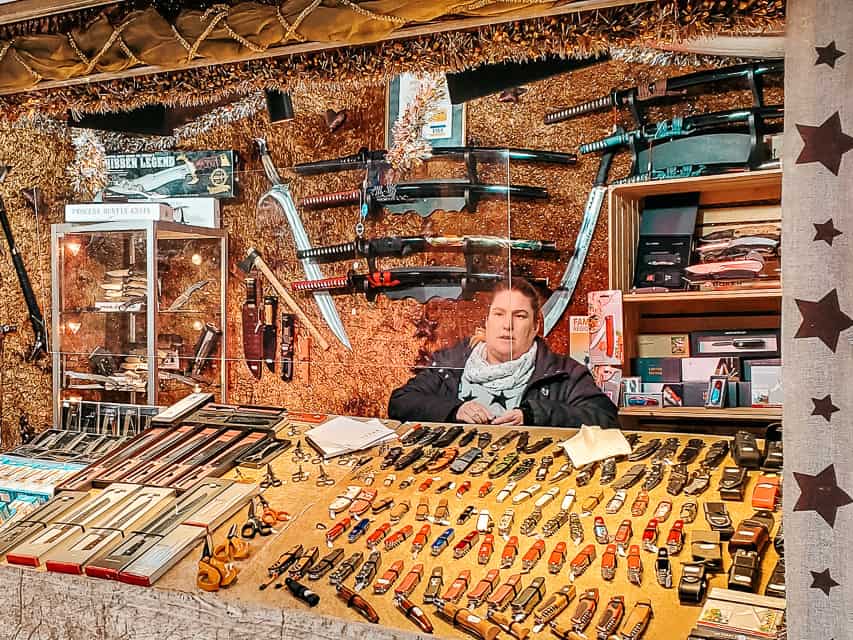 A stall at the Basel Christmas market with dozens of Swiss Army knives of shapes and sizes on display