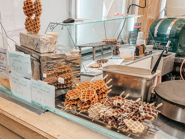 A waffle on a stick stand at the Luxembourg markets.