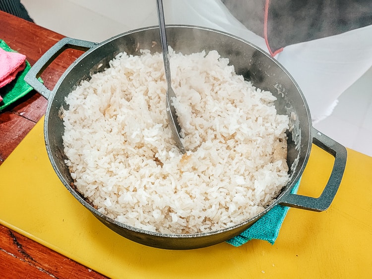 A pan of coconut rice. The rice is cooked in coconut milk instead of water. A traditional food to eat in Colombia.