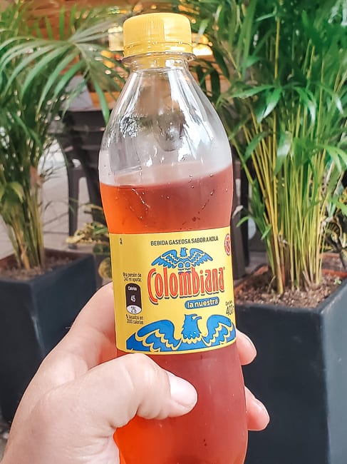 A bottle of Colombiana soda.