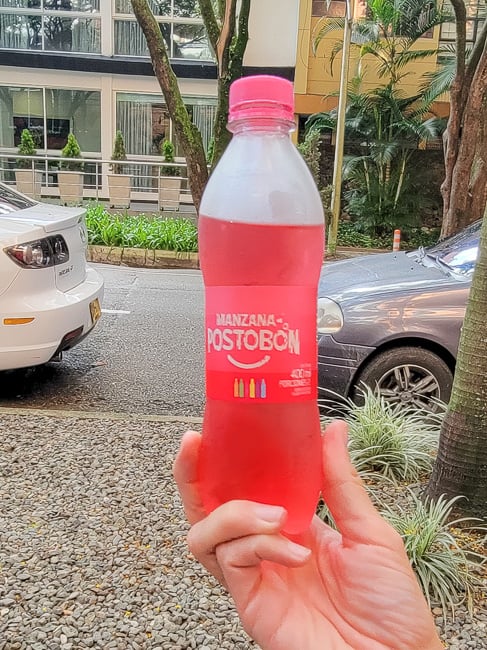 A bottle of pink Postobon soda