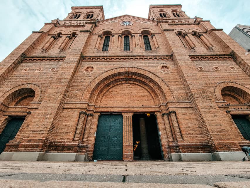 A very old and beautiful cathedral with jade green doors and dark brown bricks. This is one of the best things to do in the area..