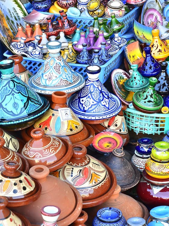 Shopping for souvenirs in Morocco you may find stacks of tagines like these, which come in various sizes and are glazed in bright colors.