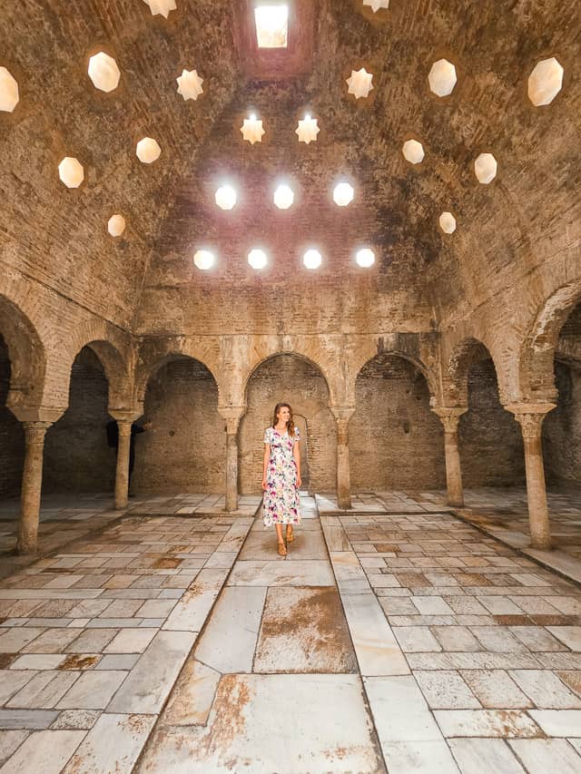 El Banuelo old Arab baths - an open floor, columns and arches around the exterior, and an arched, bricked ceiling with about 20 small octogonal holes open to the sky.