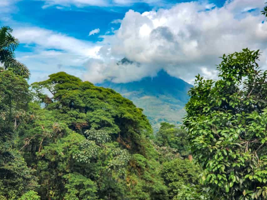 A amazing view of the Arenal Volcano with clouds covering the top/