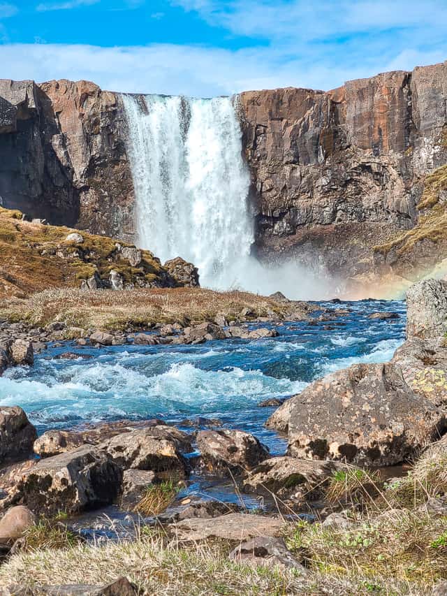 A 40 ft tall waterfall named Gufufoss is one of the big waterfalls to see, crashes down into a river with rocks all around.