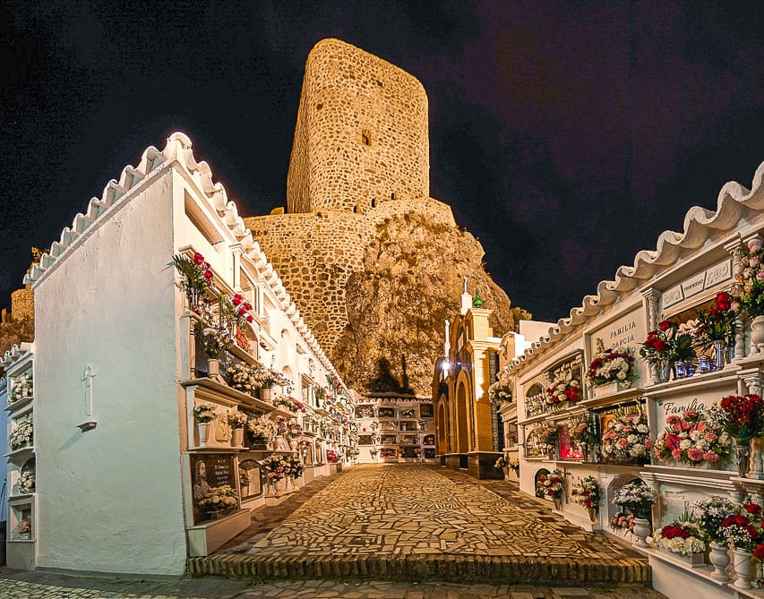 Cemetery with castle in background.