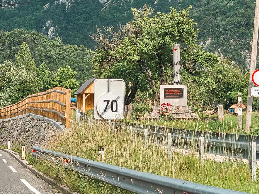 A speed limit sign with a slash through it.