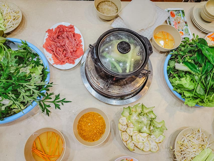 A assortment of veggies and meat on a table.