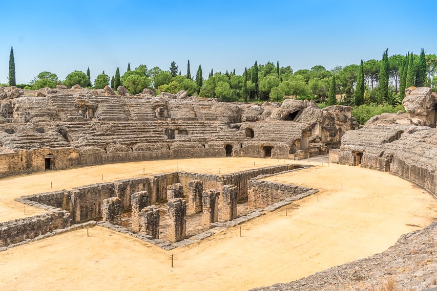 A stone old Ilitica Ruin with stone pilars underground with a tan dust ground.
