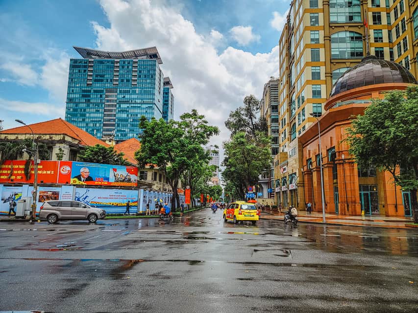 The city streets with colorful buildings on both sides of the streets with shiny tiles on both sides.