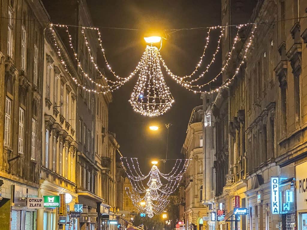 Strands of lights and chandiliers are strung between the buildings of Zagreb